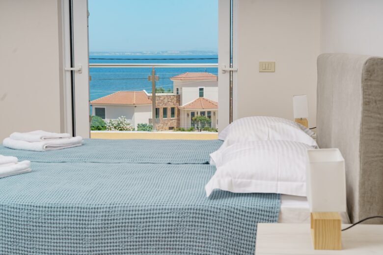 Bright bedroom with sea view in Karfas Chios featuring comfortable bed and natural light