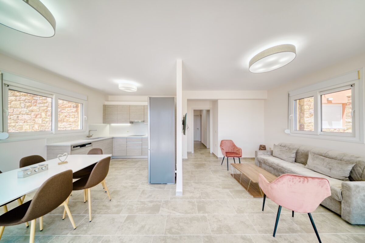 Open plan kitchen and living area with modern design in Karfas Chios apartment