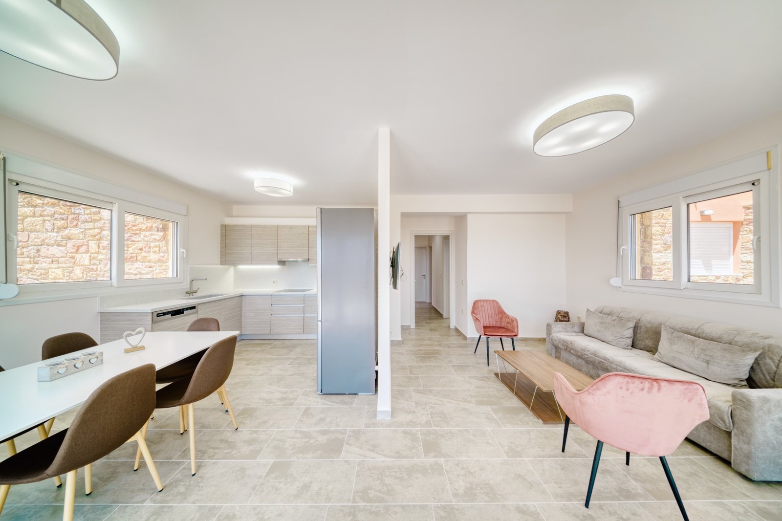 Open plan kitchen and living area with modern design in Karfas Chios apartment